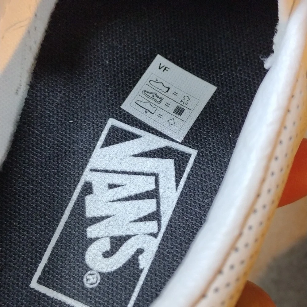 Vans men's white perforated leather slip on loafers. Size 5.5
